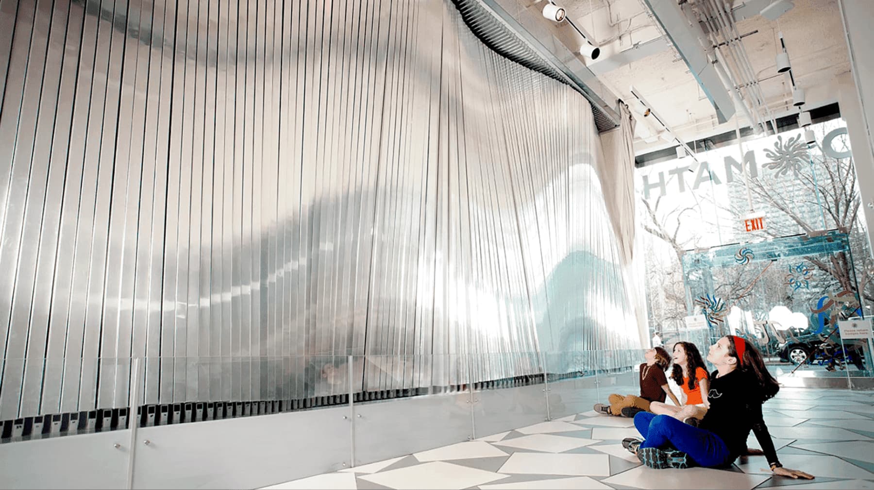 Kids watching interactive installation